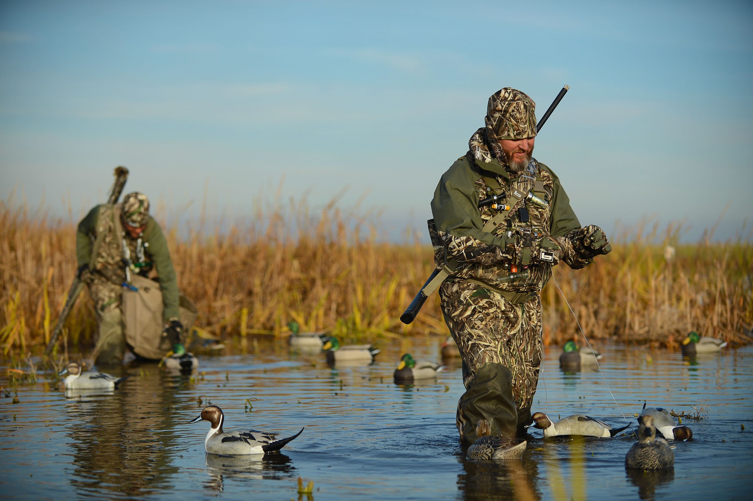 waterfowl hunters wearing mimicry camo