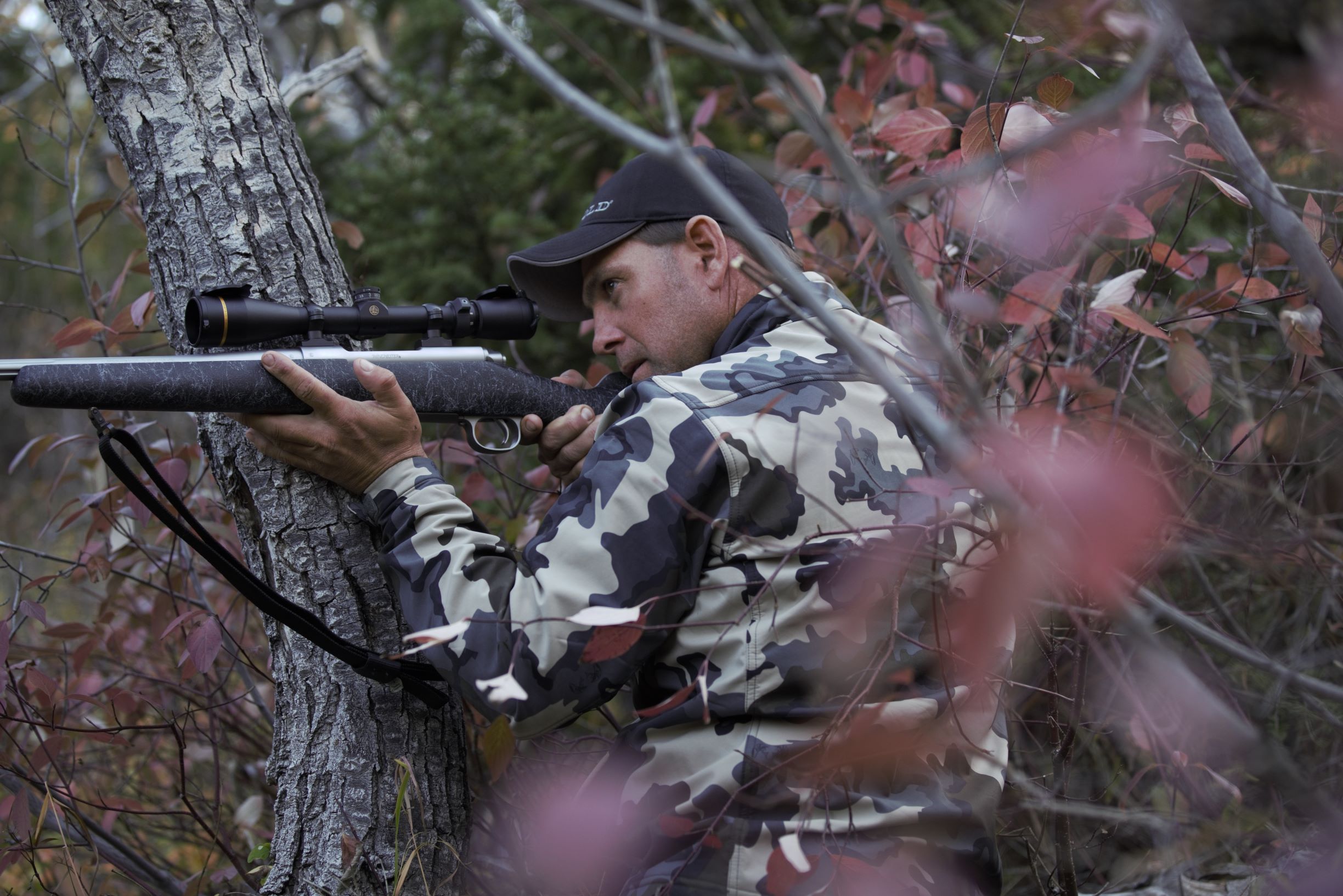 deer hunter wearing breakup camouflage